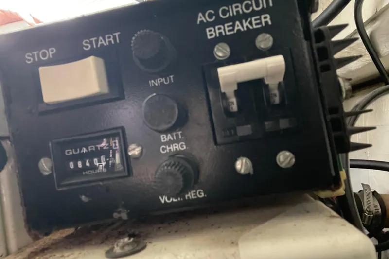 Slide: The Image of Control panel of a 2002 Carver 350 Mariner with AC circuit breaker. - 42