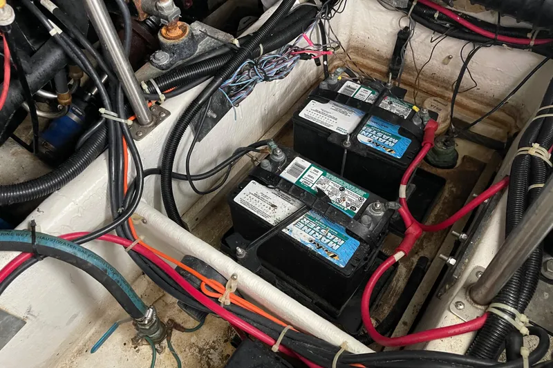 Slide: The Image of Battery compartment of a 2002 Carver 350 Mariner with wiring and connections. - 45