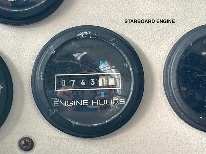 Slide: The Image of 2002 Carver 350 Mariner starboard engine hours gauge showing 743 hours. - 48