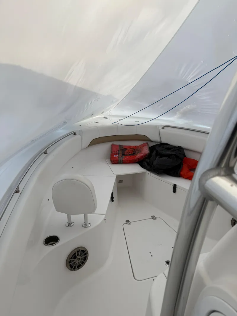 Slide: The Image of 2015 Sportsman Heritage 251 Center Console boat interior with seating and storage. - 3