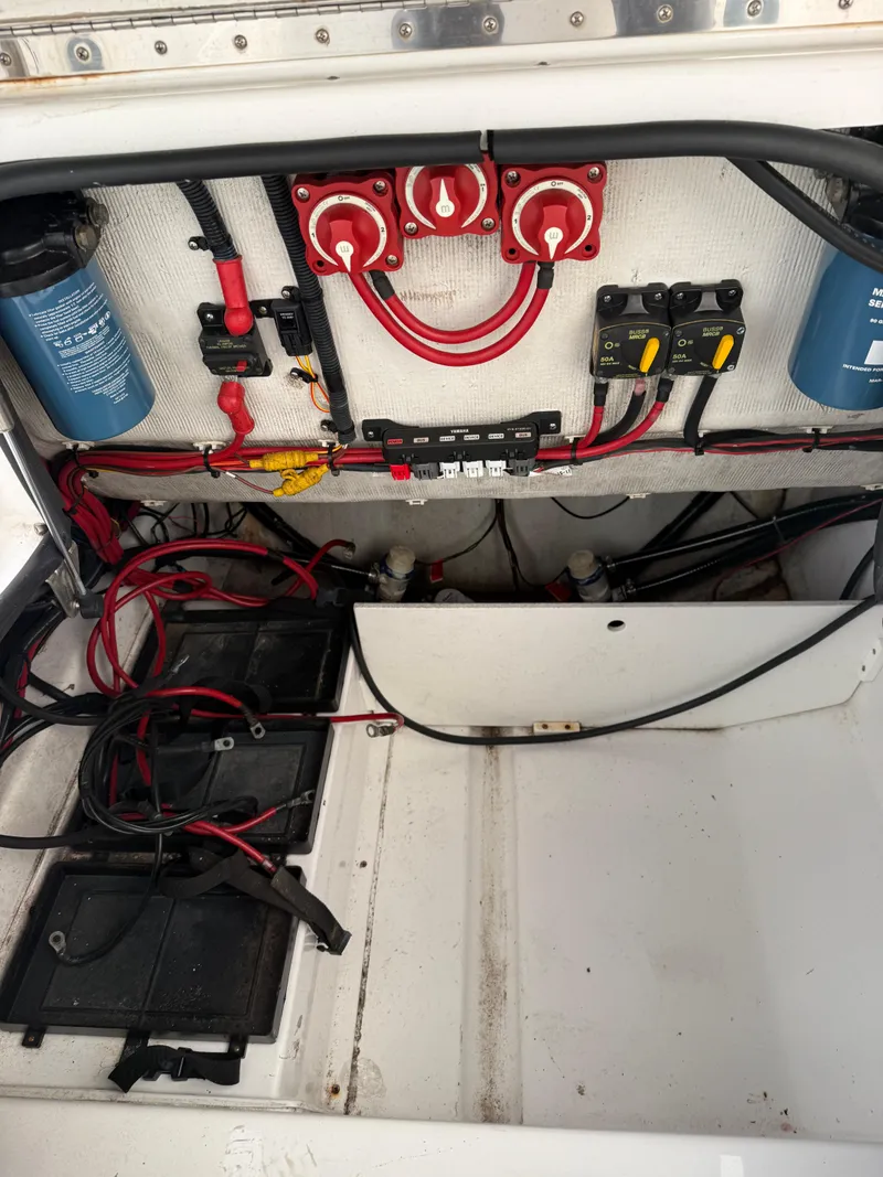 Slide: The Image of Electrical system of a 2015 Sportsman Heritage 251 Center Console boat, featuring wiring and batteries. - 8