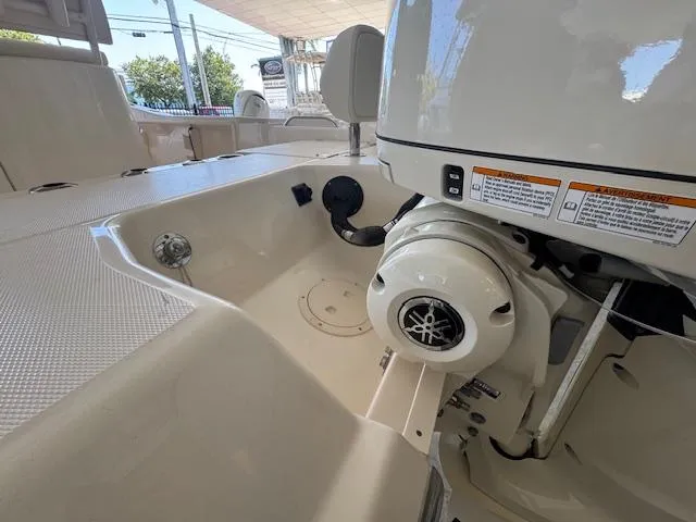 Slide: The Image of 2025 Grady-White 231 Coastal Explorer boat interior with Yamaha engine detail. - 13