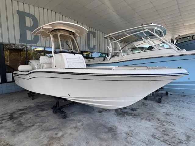 Slide: The Image of 2025 Grady-White 231 Coastal Explorer boat displayed in a showroom. - 3