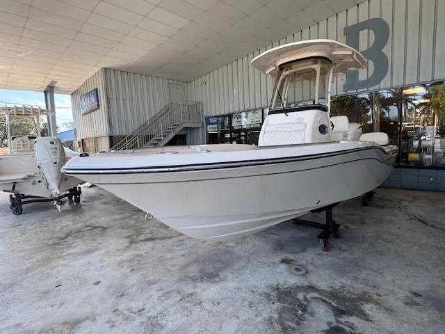 Slide: The Image of 2025 Grady-White 231 Coastal Explorer boat displayed in a showroom. - 6