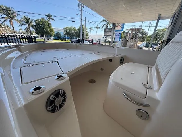 Slide: The Image of 2025 Grady-White 231 Coastal Explorer boat interior with seating and storage compartments. - 7