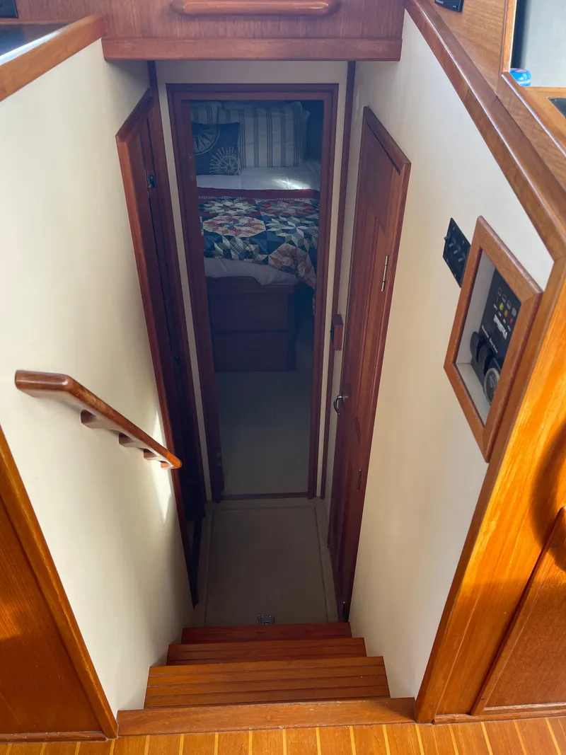 Slide: The Image of Stairway leading to cabin interior of 2005 Nordic Tug 37 boat. - 17