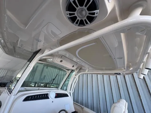 Slide: The Image of 2025 Grady-White Canyon 326 boat interior with speaker and console details. - 23
