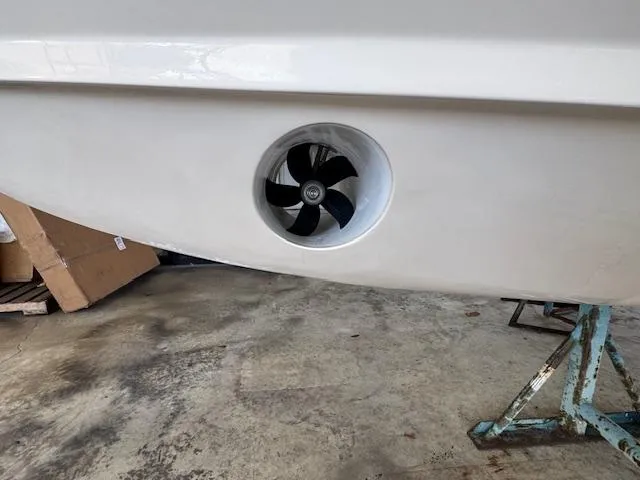 Slide: The Image of 2025 Grady-White Canyon 326 boat with a bow thruster in a workshop. - 6