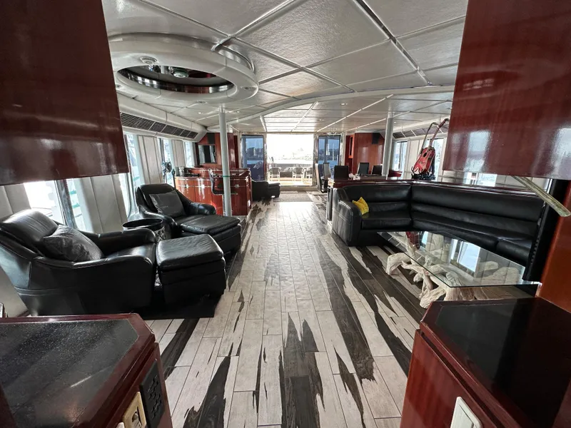 Slide: The Image of Luxurious interior of a 1996 Monte Fino 92 MY yacht with elegant seating and modern design. - 13