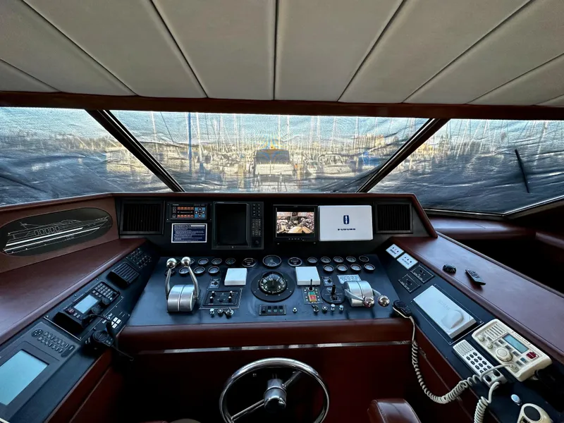 Slide: The Image of Cockpit of 1996 Monte Fino 92 MY yacht with navigation controls and displays. - 19