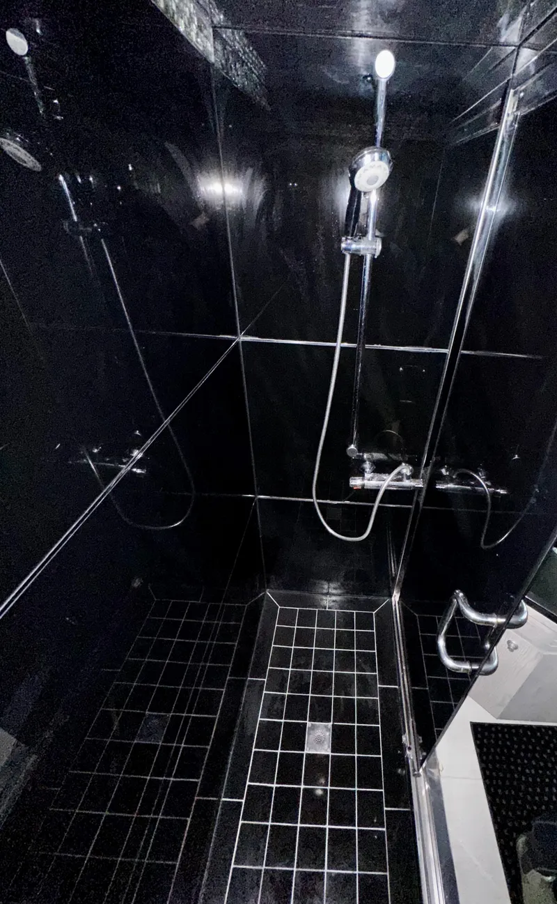 Slide: The Image of Luxurious black-tiled shower in 1996 Monte Fino 92 MY yacht bathroom. - 37