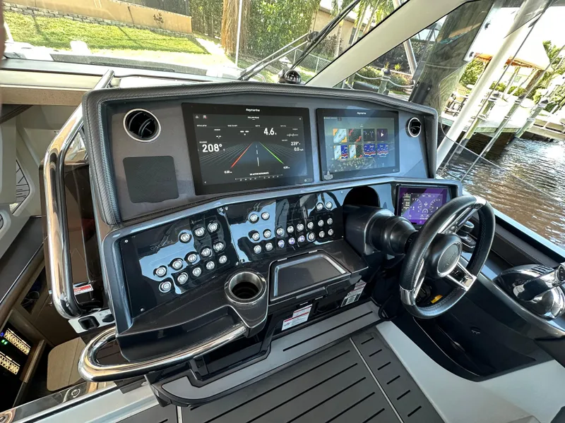 Slide: The Image of 2022 Galeon 325 GTO helm with advanced navigation displays and controls. - 32