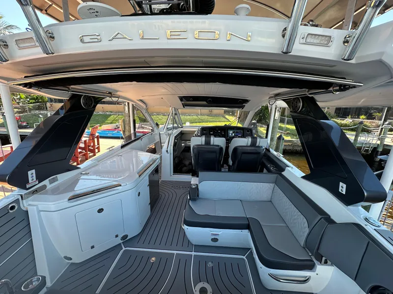 Slide: The Image of 2022 Galeon 325 GTO yacht interior with seating and helm, showcasing luxury design. - 37