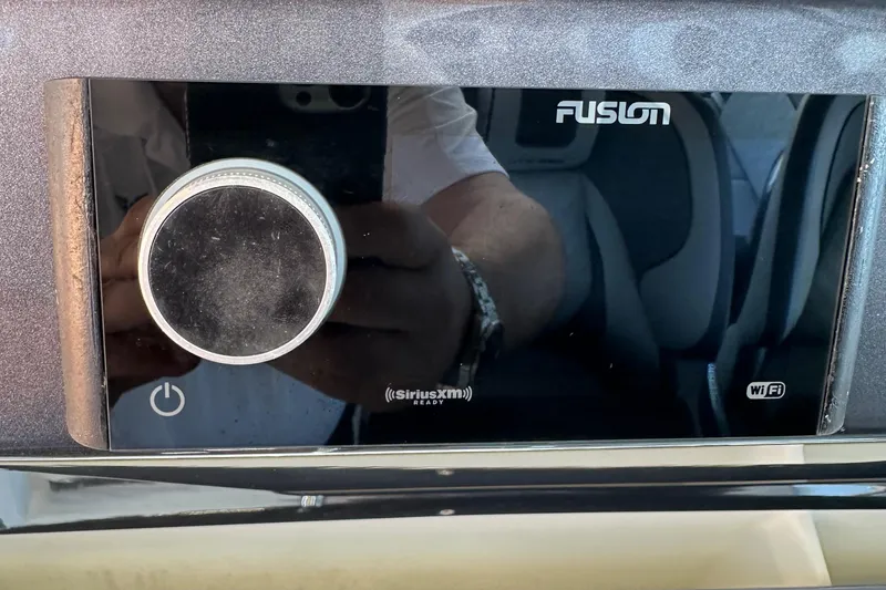 Slide: The Image of Fusion audio system in a 2022 Galeon 325 GTO yacht, featuring SiriusXM and WiFi connectivity. - 39