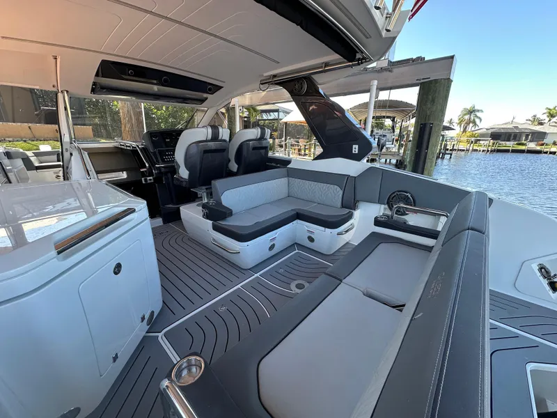 Slide: The Image of 2022 Galeon 325 GTO luxury yacht interior with modern seating and sleek design. - 40