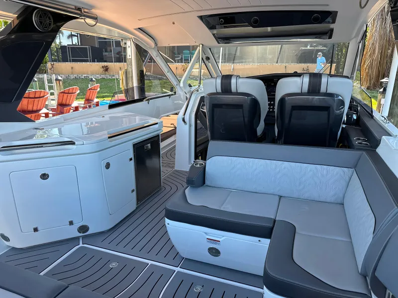 Slide: The Image of Interior of 2022 Galeon 325 GTO boat with modern seating and sleek design. - 47