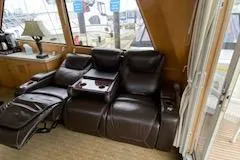 Slide: The Image of Luxurious leather recliners inside a 1995 Navigator 50 yacht, featuring a cozy interior setting. - 10