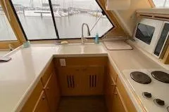 Slide: The Image of Compact kitchen area in a 1995 Navigator 50 yacht with marina view. - 17
