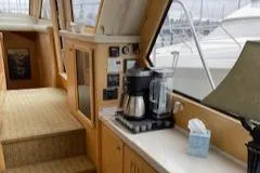 Slide: The Image of Interior of 1995 Navigator 50 yacht with coffee maker and control panel. - 23