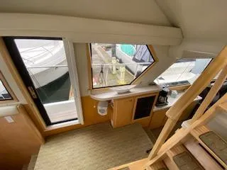 Slide: The Image of Interior view of 1995 Navigator 50 yacht with stairs and dockside window. - 24