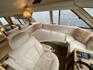 Slide: The Image of Luxurious interior of a 1995 Navigator 50 yacht with plush seating and elegant decor. - 25