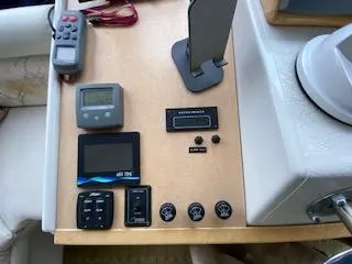 Slide: The Image of Control panel of a 1995 Navigator 50 yacht with various electronic devices. - 34