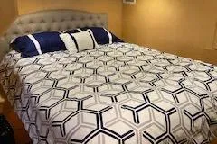 Slide: The Image of Luxurious bed with geometric-patterned bedding in a Navigator 50, 1995 model. - 45