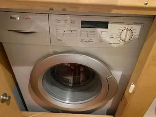 Slide: The Image of Front-loading washing machine in a wooden cabinet, Navigator 50, 1995 model. - 47