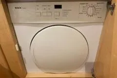 Slide: The Image of Built-in Bosch dryer inside wooden cabinet, Navigator 50, 1995 model. - 48