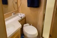 Slide: The Image of Bathroom interior of 1995 Navigator 50 yacht with toilet and sink. - 49