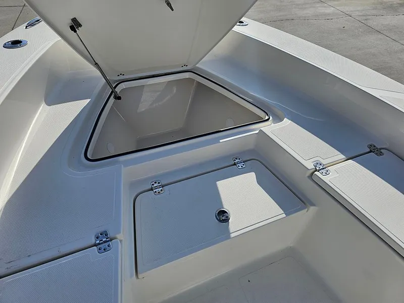 Slide: The Image of 2025 Pioneer 220 Bay Sport boat storage compartments open on deck. - 22
