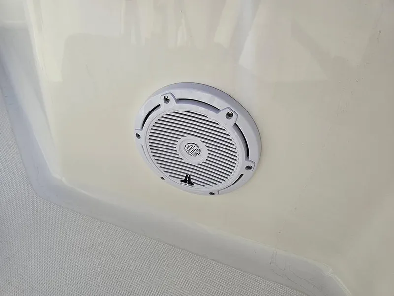 Slide: The Image of Speaker on 2025 Pioneer 220 Bay Sport boat, mounted on white surface. - 28