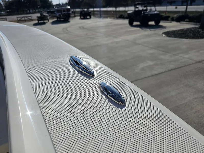 Slide: The Image of 2025 Pioneer 220 Bay Sport boat detail with sleek design and textured surface. - 29