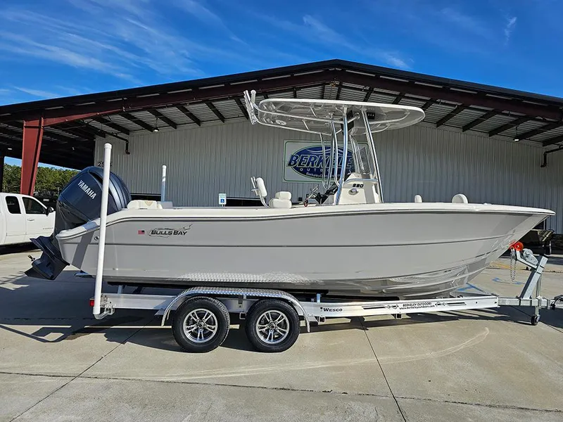 The Image of 2025 Bulls Bay 230 Center Console boat on trailer, parked outdoors. - 1