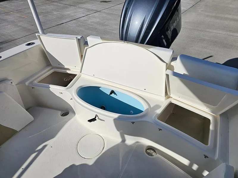 Slide: The Image of 2025 Bulls Bay 230 Center Console boat interior with storage compartments and livewell. - 11