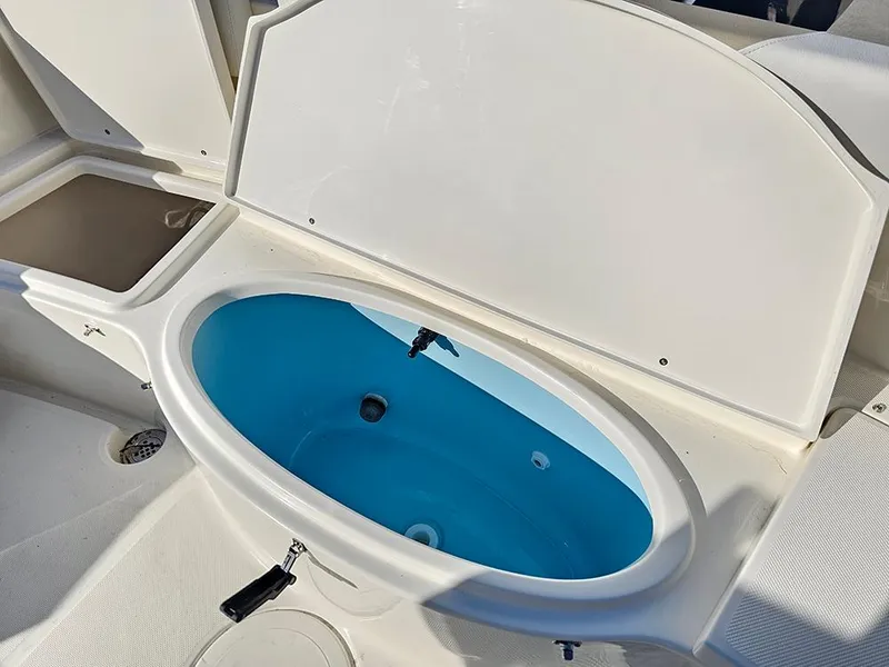 Slide: The Image of 2025 Bulls Bay 230 Center Console boat with open livewell. - 12