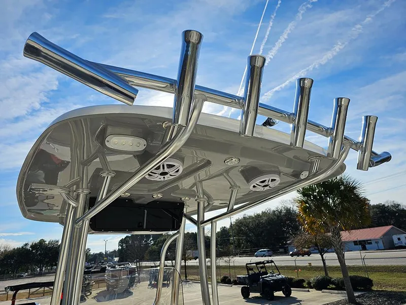 Slide: The Image of 2025 Bulls Bay 230 Center Console boat with stainless steel T-top and rod holders. - 16