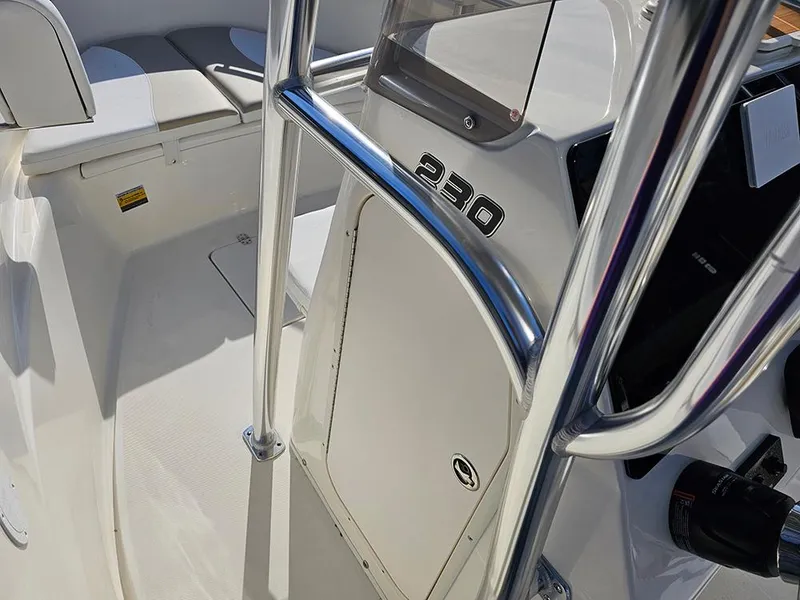 Slide: The Image of 2025 Bulls Bay 230 Center Console boat interior with seating and console details. - 20
