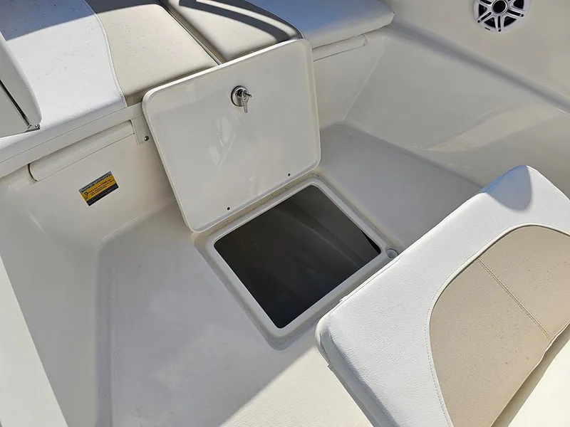 Slide: The Image of 2025 Bulls Bay 230 Center Console boat storage compartment with open hatch. - 23