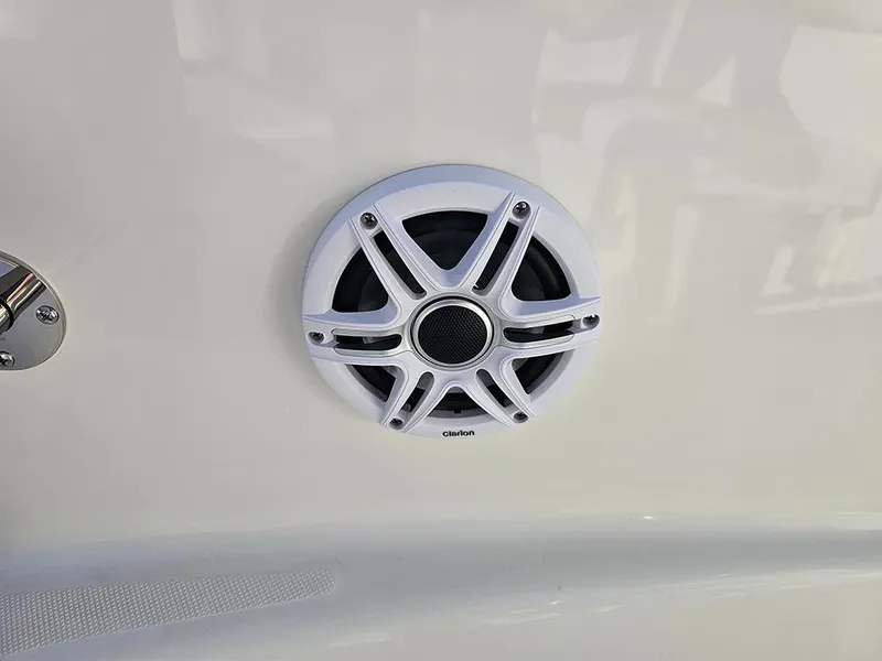 Slide: The Image of Speaker on 2025 Bulls Bay 230 Center Console boat, featuring a sleek white design. - 26