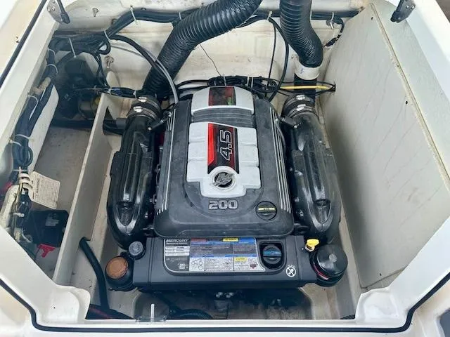 Slide: The Image of 2018 Bayliner VR5 Bowrider I/O engine compartment with 4.5L 200 HP engine. - 10