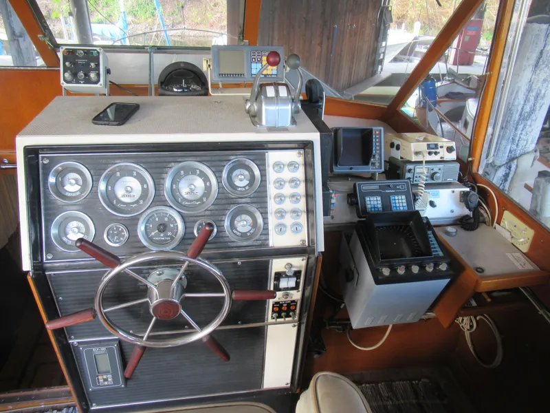 Slide: The Image of 1963 Chris-Craft Constellation helm with vintage gauges and navigation equipment. - 12