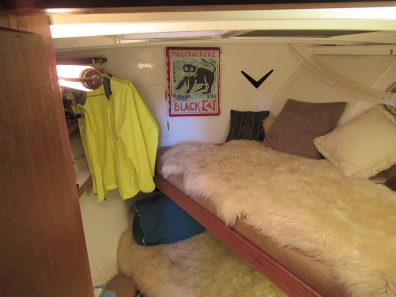 Slide: The Image of Cozy cabin interior of 1963 Chris-Craft Constellation with vintage decor and plush bedding. - 16