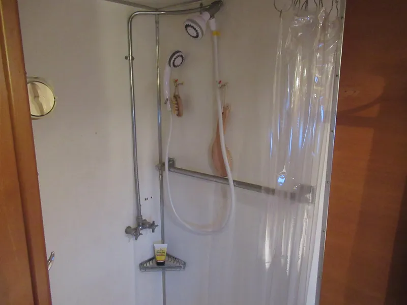 Slide: The Image of Shower area inside a 1963 Chris-Craft Constellation boat with vintage fixtures. - 26