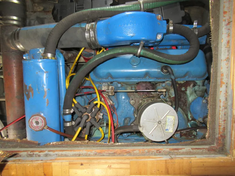 Slide: The Image of 1963 Chris-Craft Constellation engine, blue components, visible wiring and hoses. - 27