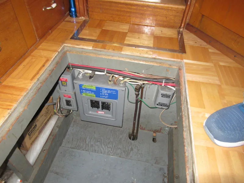 Slide: The Image of Electrical panel inside 1963 Chris-Craft Constellation boat, under wooden floor hatch. - 30