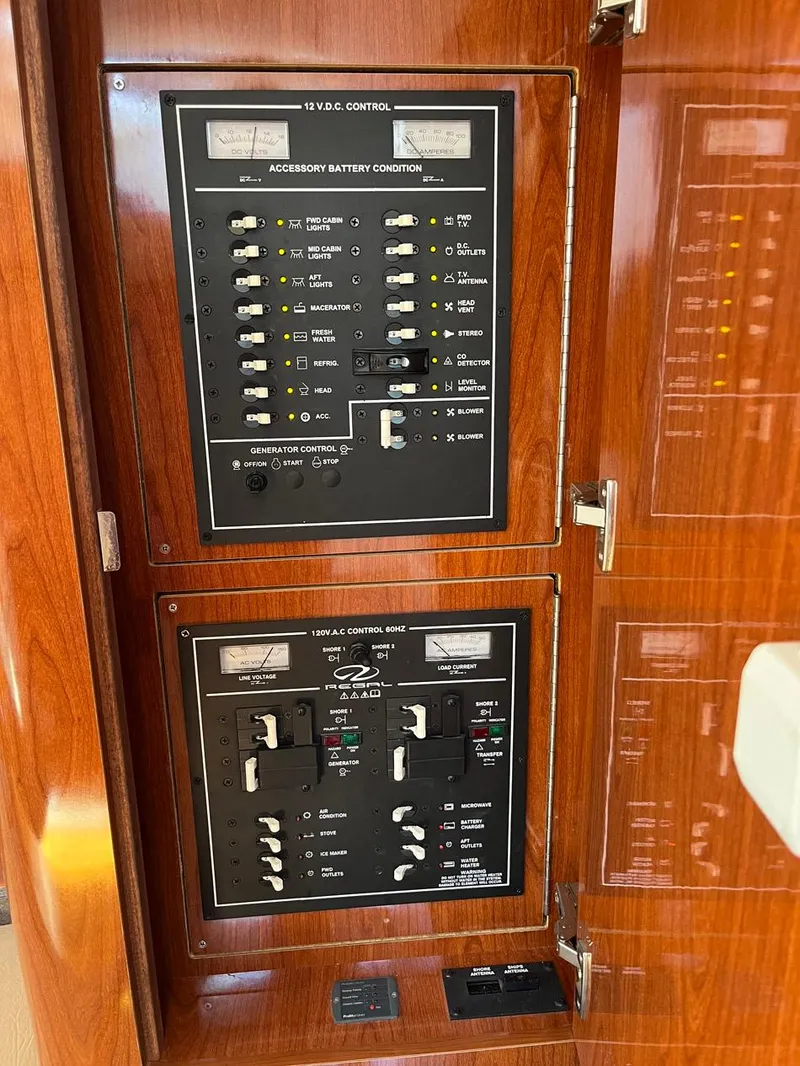 Slide: The Image of Electrical control panel on a 2011 Regal 35 Express Cruiser boat. - 10