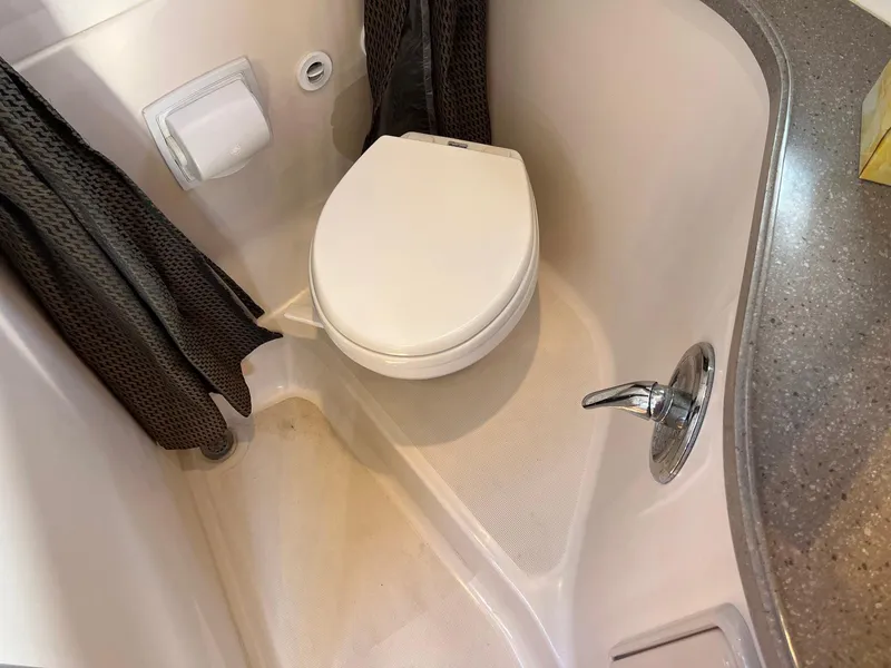 Slide: The Image of Compact bathroom in 2011 Regal 35 Express Cruiser with toilet and shower. - 14