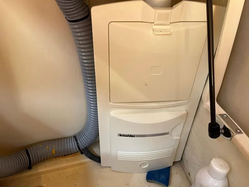 Slide: The Image of Boat interior showing a 2011 Regal 35 Express Cruiser's electrical panel and wiring. - 17