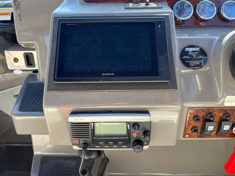 Slide: The Image of Control panel of a 2011 Regal 35 Express Cruiser with Garmin navigation system. - 24